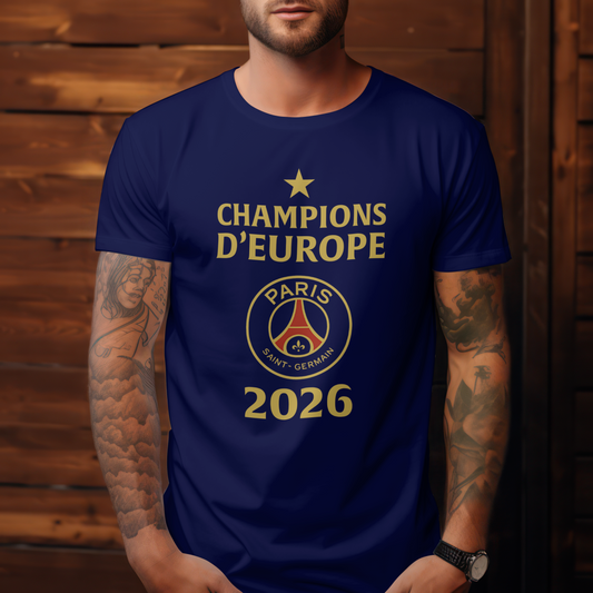 A navy unisex t-shirt featuring the design includes a gold star at the top, the words 'CHAMPIONS D’EUROPE' in gold, the Paris Saint-Germain crest in the center, and the year '2026' in large gold numbers. European Champions League 2026